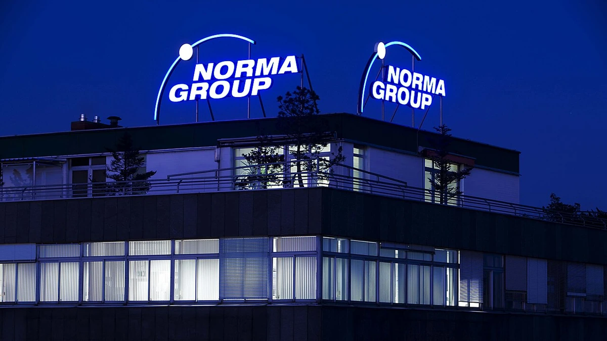 NORMA Group headquarters building in Maintal, Germany, with illuminated NORMA Group signage.
