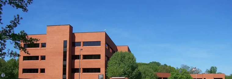 Paychex headquarters in Penfield, New York, with the Paychex sign visible in front of the building.