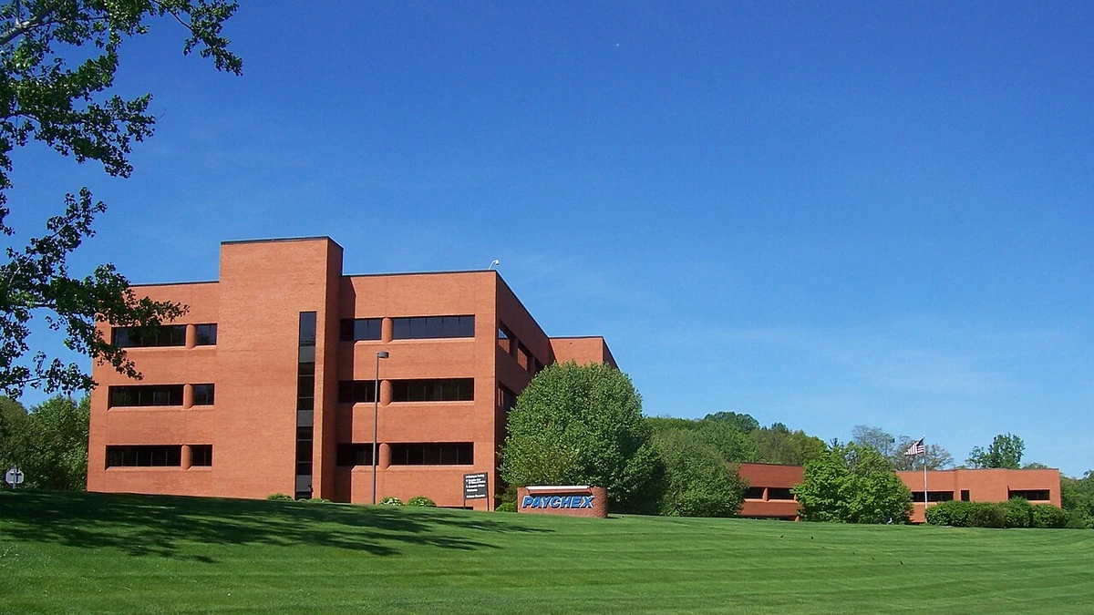 Paychex headquarters in Penfield, New York, with the Paychex sign visible in front of the building.