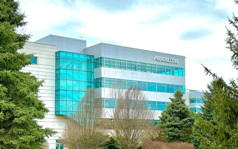 Progressive Insurance headquarters in Mayfield Village, Ohio, with the Progressive sign visible on the building.