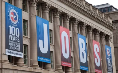 U.S. Chamber of Commerce Building in Washington, D.C., with large JOBS banners.