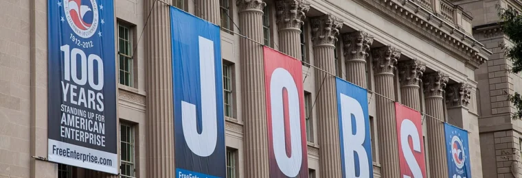 U.S. Chamber of Commerce Building in Washington, D.C., with large JOBS banners.