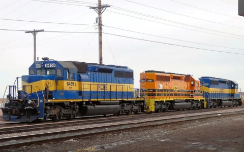 Rapid City, Pierre & Eastern Railroad locomotives 6459, 3431 and 6450 on railroad tracks.