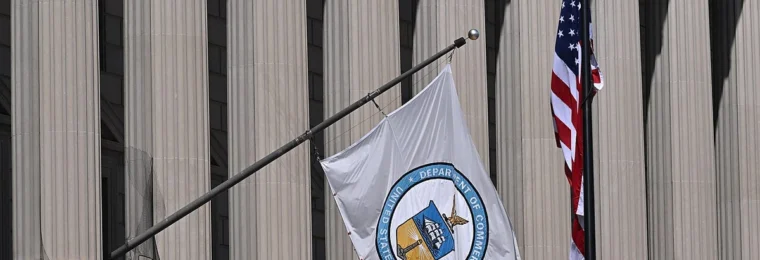 U.S. Department of Commerce flag outside the Herbert C. Hoover Building in Washington, D.C.