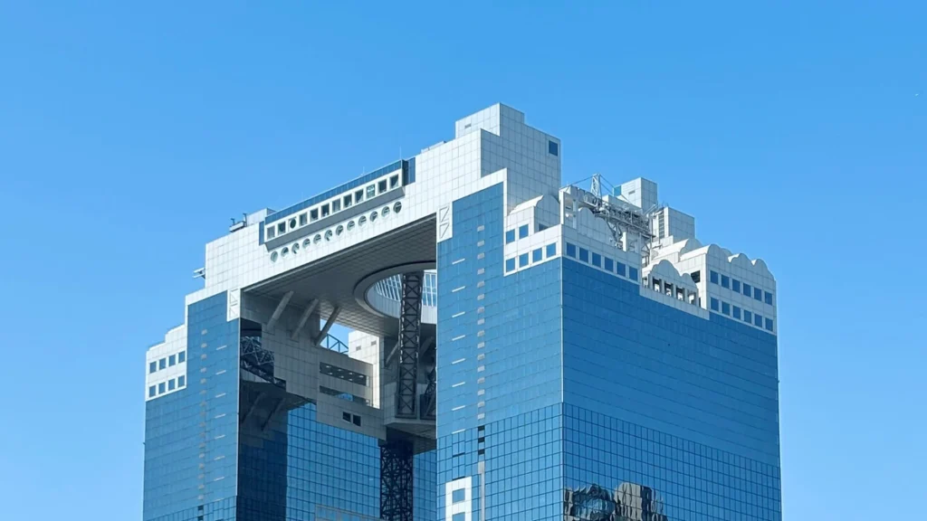 Umeda Sky Building in Osaka under a clear blue sky.
