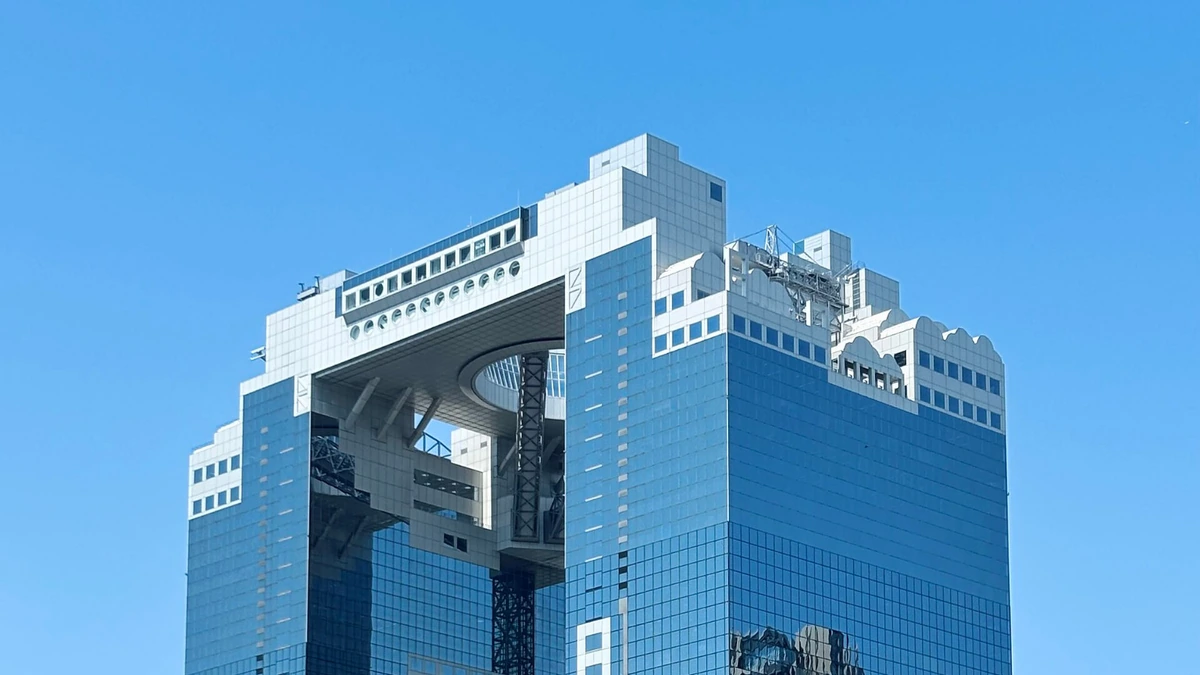 Umeda Sky Building in Osaka under a clear blue sky.
