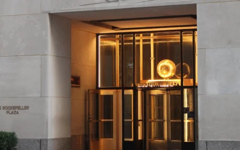 Entrance to 45 Rockefeller Plaza in Manhattan, with the street address visible on the stone facade.