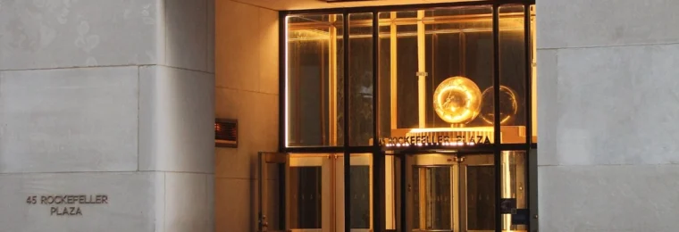 Entrance to 45 Rockefeller Plaza in Manhattan, with the street address visible on the stone facade.