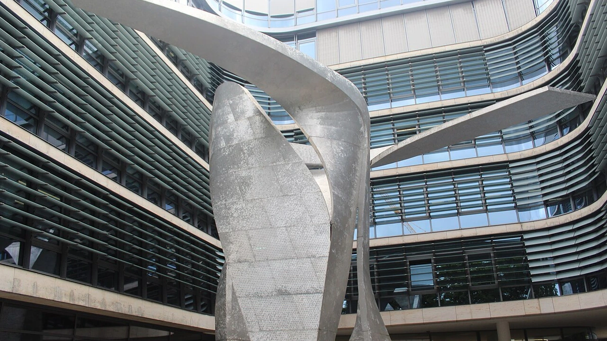 Siemens AG corporate headquarters courtyard in Munich with The Wings sculpture in the foreground.