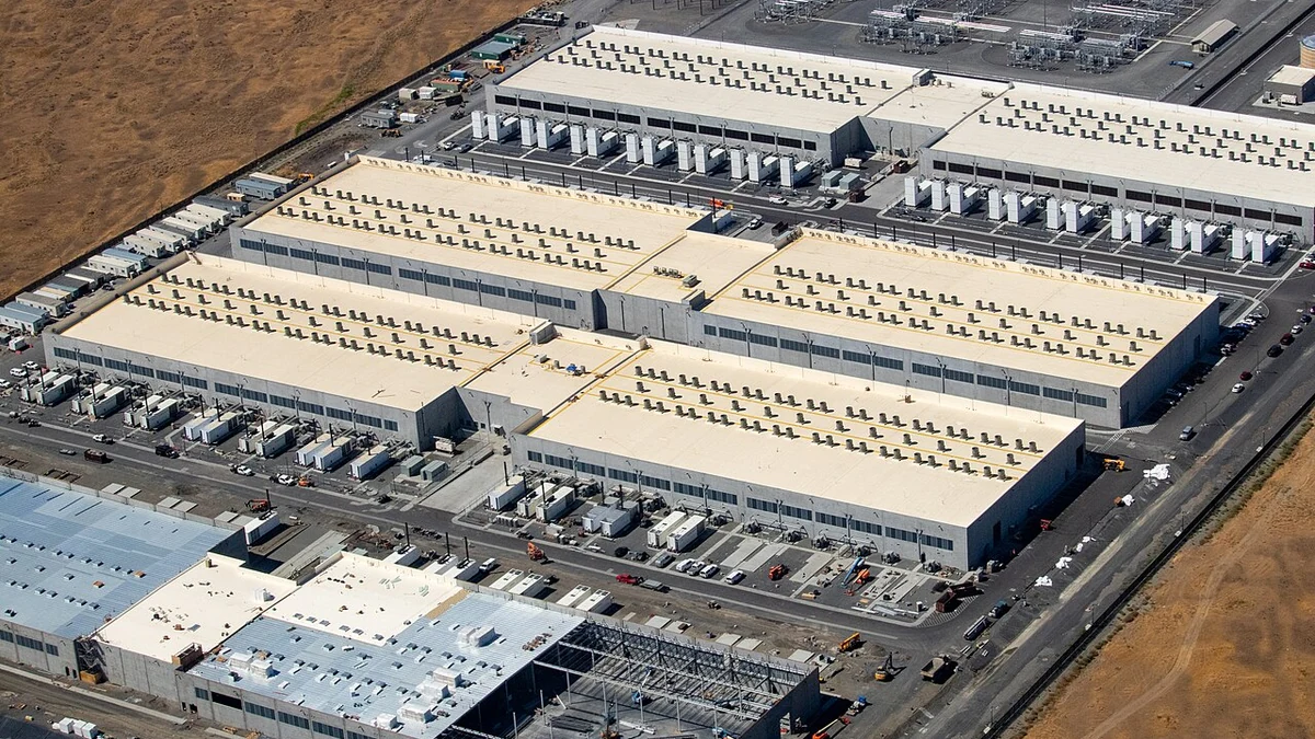 Aerial view of AWS data center buildings in Oregon, with one building under construction.