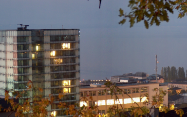Swiss Federal Statistical Office buildings in Neuchâtel at dusk.