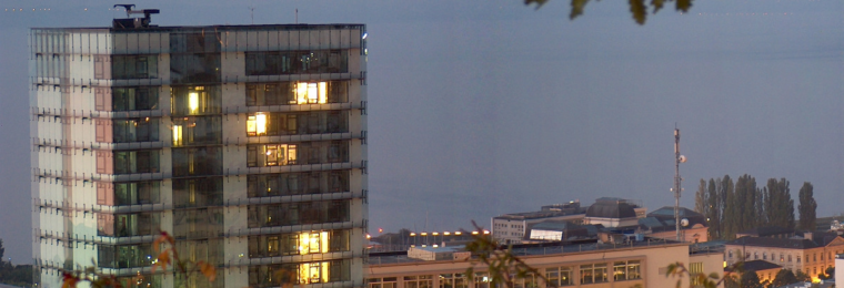 Swiss Federal Statistical Office buildings in Neuchâtel at dusk.