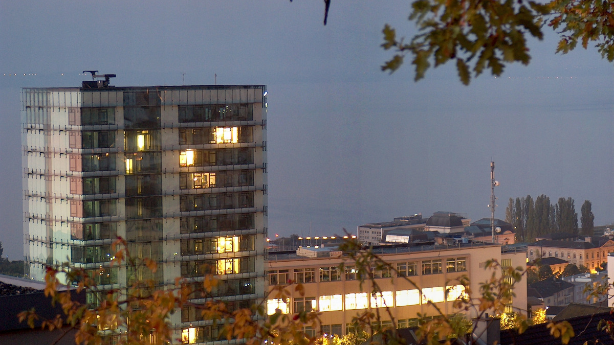 Swiss Federal Statistical Office buildings in Neuchâtel at dusk.