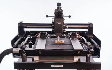 Semiconductor probe station with microscope and precision testing fixtures.