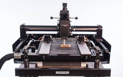 Semiconductor probe station with microscope and precision testing fixtures.