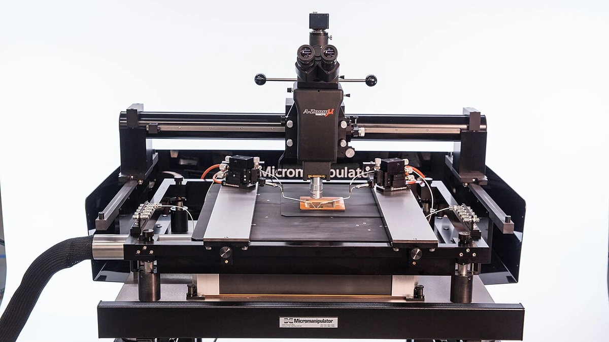 Semiconductor probe station with microscope and precision testing fixtures.
