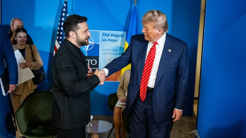 Donald Trump shakes hands with Ukrainian President Volodymyr Zelenskyy at the 2025 NATO summit in The Hague.