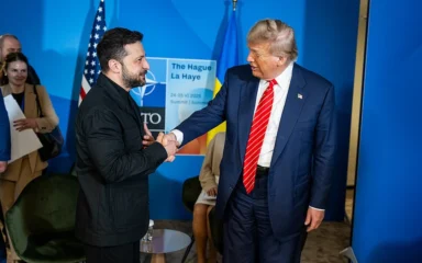 Donald Trump shakes hands with Ukrainian President Volodymyr Zelenskyy at the 2025 NATO summit in The Hague.