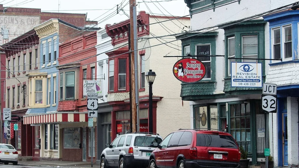 Storefronts and parked vehicles along Broad Street in Waterford, New York.