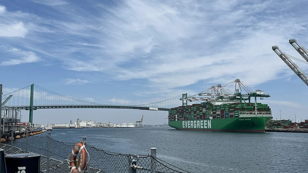Ever Mach container ship at the Port of Los Angeles with the Vincent Thomas Bridge in the background.