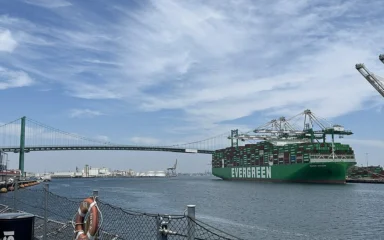 Ever Mach container ship at the Port of Los Angeles with the Vincent Thomas Bridge in the background.
