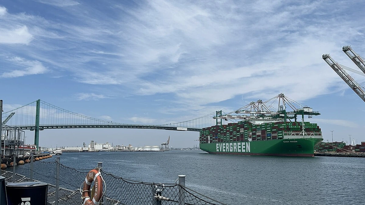 Ever Mach container ship at the Port of Los Angeles with the Vincent Thomas Bridge in the background.