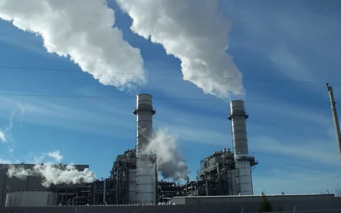 Two tall stacks and vapor plumes at Riverside Energy Center in Wisconsin.