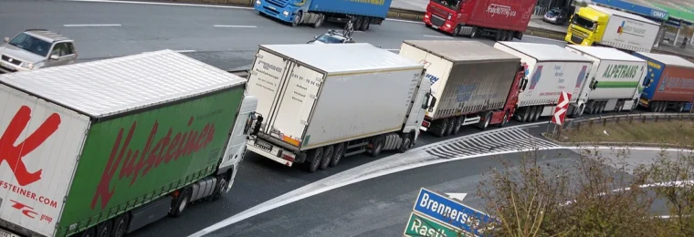 Freight trucks in traffic near the Brenner Pass on the Austria-Italy border.