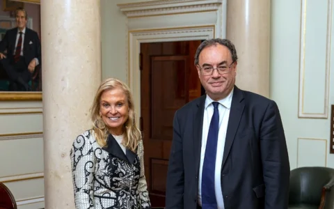 Bank of England Governor Andrew Bailey stands beside then U.S. Ambassador Jane Hartley during a meeting in 2022.