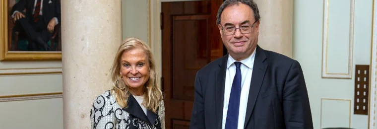 Bank of England Governor Andrew Bailey stands beside then U.S. Ambassador Jane Hartley during a meeting in 2022.