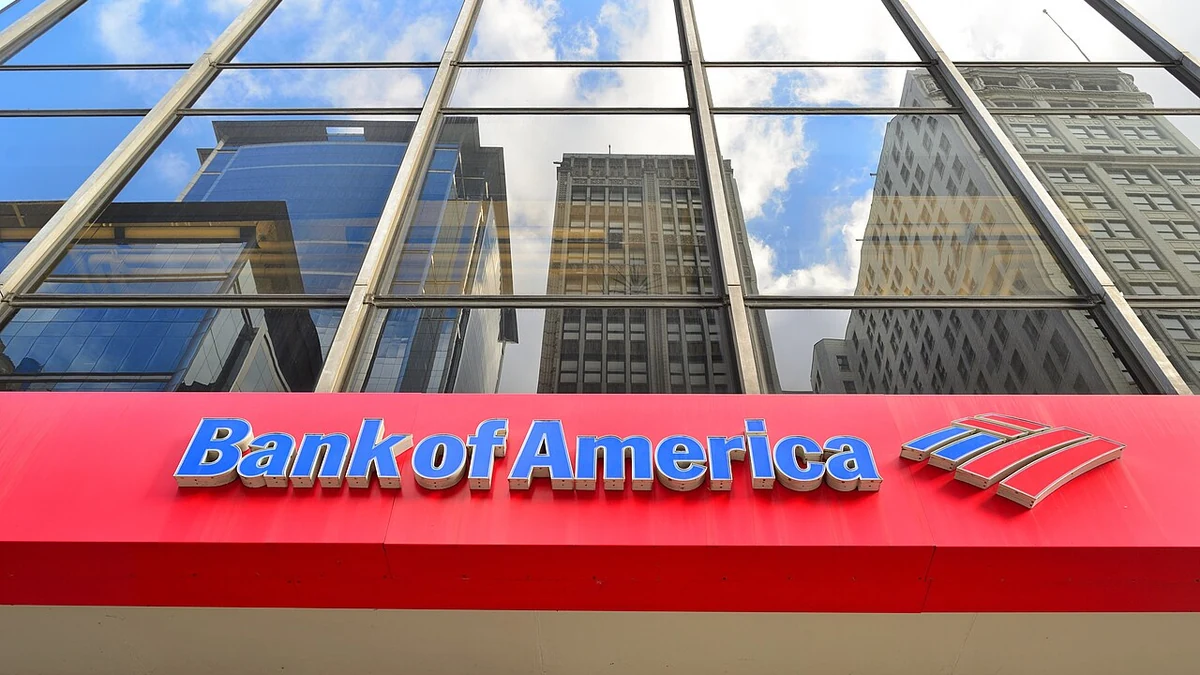 Bank of America signage at a Chicago branch beneath reflective glass windows.