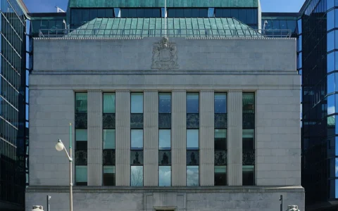 Stone-and-glass facade of the Bank of Canada headquarters in Ottawa, seen from Wellington Street.