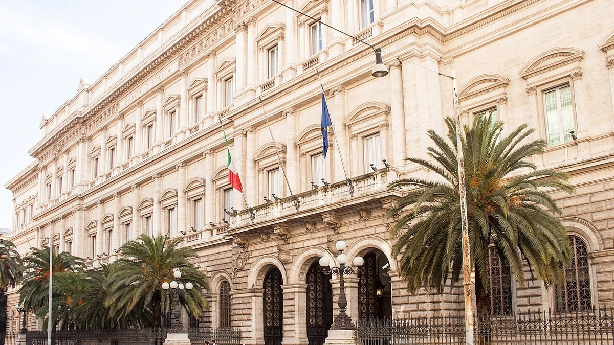 Palazzo Koch, the Bank of Italy headquarters in Rome, with its stone facade, entrance and national flags.