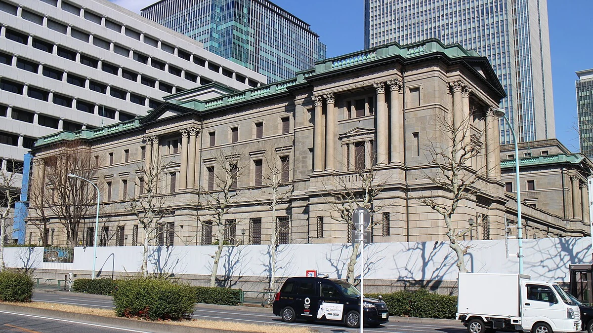 Exterior of the Bank of Japan headquarters in Tokyo, showing its stone facade and columns.