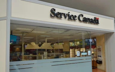 Entrance to a Service Canada office in Malvern Town Centre, Toronto, with Service Canada signage above the glass storefront.