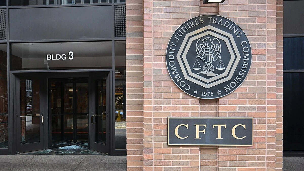 Entrance to the Commodity Futures Trading Commission building in Washington, D.C., with the agency’s round seal and CFTC sign clearly visible.