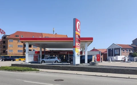 Circle K petrol station in Denmark with forecourt, pumps and price sign visible.
