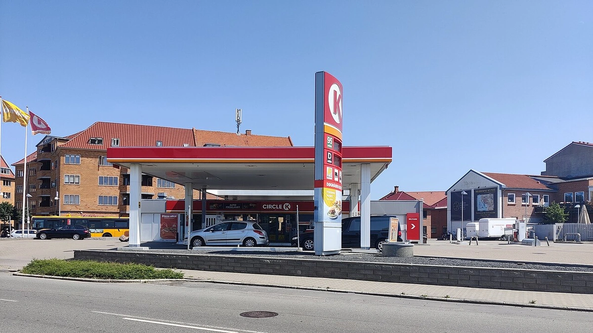 Circle K petrol station in Denmark with forecourt, pumps and price sign visible.