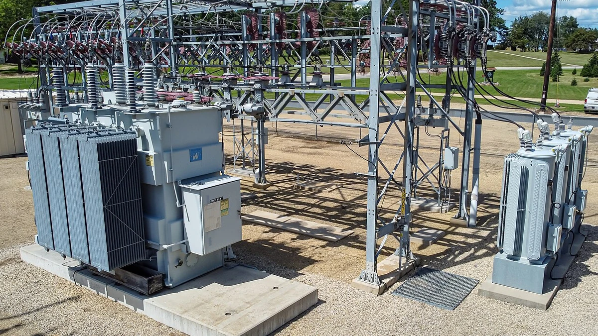Power transformers, insulators and electrical equipment at an outdoor substation in Wisconsin.