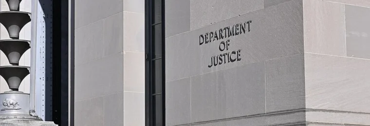 Department of Justice lettering on the facade of the Robert F. Kennedy Department of Justice Building in Washington, D.C.