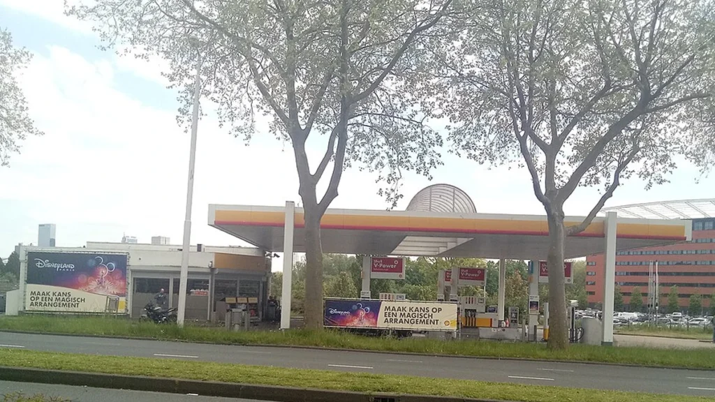 Shell petrol station in Rotterdam, Netherlands, with fuel pumps beneath its canopy.