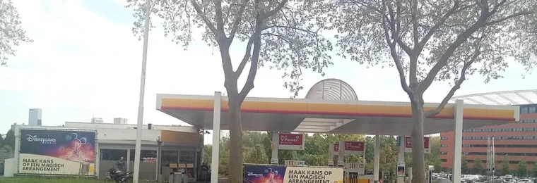 Shell petrol station in Rotterdam, Netherlands, with fuel pumps beneath its canopy.