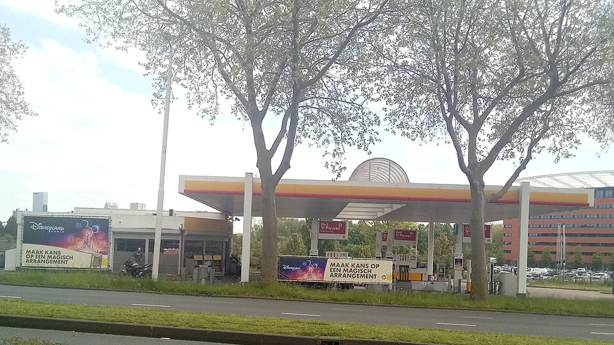Shell petrol station in Rotterdam, Netherlands, with fuel pumps beneath its canopy.