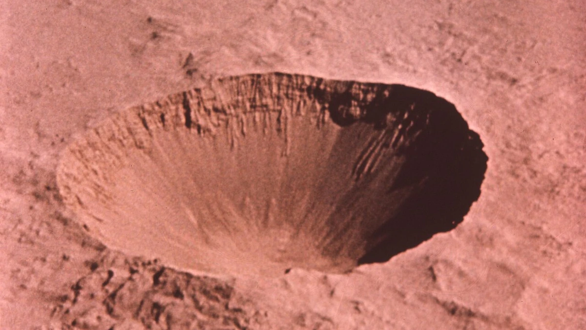 Historical aerial photograph of the large Sedan Crater at the Nevada Test Site.