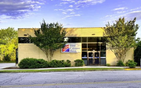 Exterior of a First Citizens Bank branch in Toccoa, Georgia, with the bank sign above the entrance.