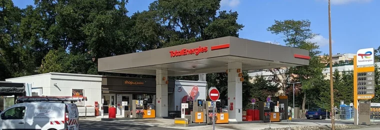 TotalEnergies petrol station on Route d'Agde in Toulouse, France, with fuel pumps beneath the canopy.