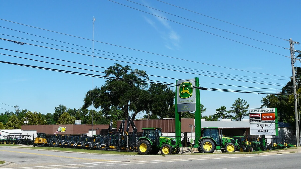 Agricultural equipment displayed outside an Ag-Pro John Deere dealership in Tallahassee, Florida.