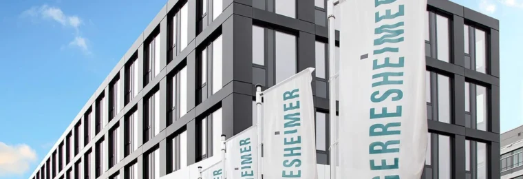 Gerresheimer AG headquarters in Düsseldorf with Gerresheimer flags outside.