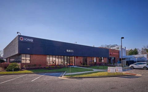 IonQ headquarters building in College Park, Maryland, with the company sign above the entrance.