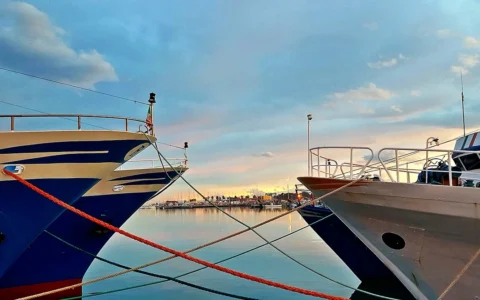 Fishing boats on the quay of the north pier of the port of San Benedetto del Tronto, Italy.